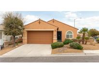 Charming single-story home with a well-manicured front yard and a two-car garage at 2970 Strathspey Ct, Henderson, NV 89044