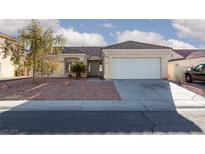 Charming single-story home with well-maintained landscaping and a two-car garage at 3514 Shonna Way, North Las Vegas, NV 89032