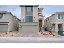 Contemporary two-story home with a two-car garage, small front yard, and minimalist desert landscaping at 5748 Avondale Rise Way, Las Vegas, NV 89141