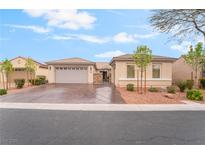 Charming single-story home with a well-manicured front yard and three car garage at 8506 River Ridge Dr, Las Vegas, NV 89131