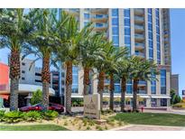 Beautiful high-rise building exterior with professional landscaping and manicured lawn, with mature palms in Las Vegas at 200 W Sahara Ave # 3009, Las Vegas, NV 89102