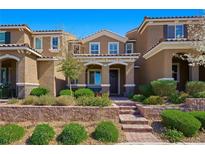 Charming two-story home with landscaped yard and brick steps to covered porch at 2816 Turnstone Ridge St, Henderson, NV 89044