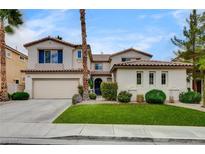 Charming two-story home with a well-manicured lawn and attached two-car garage at 2944 Carmelo Dr, Henderson, NV 89052