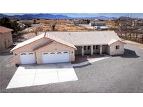 Beautiful home with a two car garage and a large driveway for extra parking at 3360 S Rainbow Ave, Pahrump, NV 89048