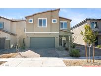 Inviting two-story home featuring a two-car garage and low-maintenance landscaping at 3807 Andorian Ave, North Las Vegas, NV 89084