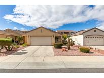 Charming single-story home with a two-car garage and low-maintenance landscaping at 563 Cypress Gardens Pl, Henderson, NV 89012