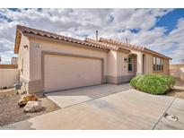 Charming single-story home featuring a tile roof, two-car garage, and well-maintained landscaping at 576 Bayo Canyon Ct, Henderson, NV 89015