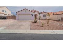 Charming single-story home featuring a well-maintained front yard and a two-car garage at 8034 Villa Armando St, Las Vegas, NV 89131