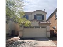 Charming two-story home features a well-maintained lawn and attached two-car garage at 8301 Strawberry Spring St, Las Vegas, NV 89143
