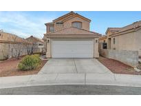 Charming two-story home with a two-car garage and desert landscaping at 9177 Bucksprings Dr, Las Vegas, NV 89129