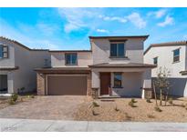 Charming two-story home featuring a brick-accented facade and a well-manicured front yard at 9333 Observatory St, Las Vegas, NV 89143