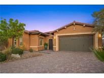 Charming single-story home with a well-manicured front yard and a spacious two-car garage at 294 Besame Ct, Las Vegas, NV 89138