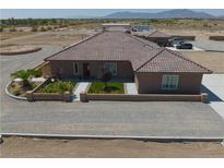 Charming single-story home featuring a tile roof and a well-maintained front yard with tasteful landscaping at 3181 W Bell Vista Ave # 2, Pahrump, NV 89060