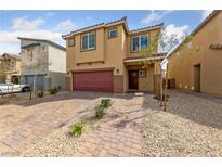 Charming two-story home featuring a paver driveway and attached two-car garage at 3835 Berenices Ave, North Las Vegas, NV 89084