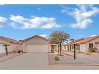 Charming single-story home featuring desert landscaping, a spacious driveway, and an attached two-car garage at 5533 Ramirez St, North Las Vegas, NV 89031