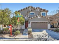 Charming two-story home with a well-maintained front yard, perfect for families or first-time homebuyers at 2207 Low Creek Ct, Las Vegas, NV 89123