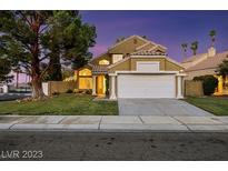 Charming two-story home featuring manicured landscaping, a spacious two-car garage, and desert style xeriscaping at 3024 Half Shell Way, Las Vegas, NV 89128