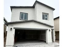Two-story home showcasing a neutral exterior with an attached two car garage at 3352 La Cura Ave # Lot 73, Las Vegas, NV 89141