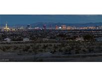 Expansive city view showcasing the bright skyline and distant mountains from atop a desert landscape in Las Vegas at 5234 Savannah Rose St, Las Vegas, NV 89149
