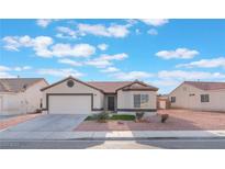 Charming single-story home with a two-car garage and low-maintenance desert landscaping at 629 Majestic Sky Dr, North Las Vegas, NV 89031