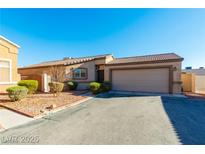 Charming single-story home features a two-car garage and low-maintenance landscaping at 6684 Black Oil Dr, Las Vegas, NV 89122