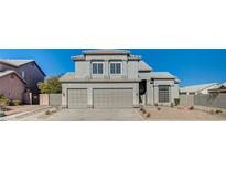 Stunning two-story home with a three-car garage and manicured landscaping at 7900 Holly Knoll Ave, Las Vegas, NV 89129