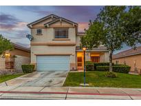 Two-story home with tidy landscaping, front lawn, and a two-car garage on a sunny day at 9020 Loggers Mill Ave, Las Vegas, NV 89143