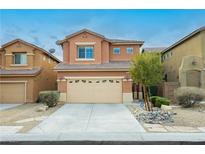Charming two-story home with a two-car garage, desert landscaping, and a classic stucco facade at 9211 Placer Bullion Ave, Las Vegas, NV 89178