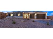 Beautiful single-story home with two-car garage and desert landscaping at 9930 Zakos Ct, Las Vegas, NV 89149