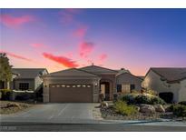 Charming single-story home with desert landscaping and a covered entryway at sunset at 2142 Oliver Springs St, Henderson, NV 89052