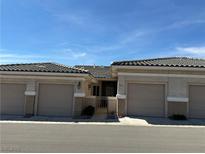 Charming home featuring a neutral stucco exterior, tile roof, and a well-maintained, private front entrance at 3213 Partridge Run St, Laughlin, NV 89029