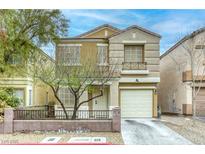 Charming two-story home featuring a well-manicured lawn, desert landscaping and a single-car garage at 3650 Mcmurty Ct, Las Vegas, NV 89129