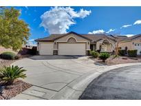 Charming home with a well-maintained lawn and a three car garage, perfect for curb appeal at 3734 John Bailey St, Las Vegas, NV 89129