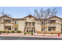 Inviting two-story condo with well-manicured landscaping and conveniently located stairways to access units at 3925 Lazy Pine St # 204, Las Vegas, NV 89108