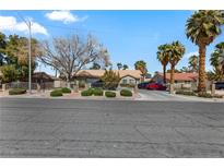 Charming single-story home with well-manicured landscaping and mature trees enhancing its curb appeal at 4300 Del Monte Ave, Las Vegas, NV 89102