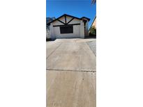 Charming home with a driveway and unique architectural details in the front at 503 Crony Ave, Henderson, NV 89011