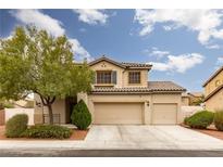 Charming two-story home featuring a well-maintained lawn and a two-car garage at 5609 Hannah Gordon Ct, North Las Vegas, NV 89081