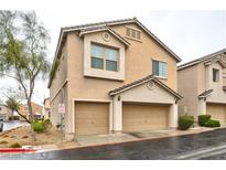 Charming two-story home featuring a two-car garage and desert landscaping at 11023 Mount George St, Las Vegas, NV 89179