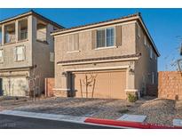 Charming two-story home with a two-car garage and neutral stucco finish at 1328 Graphite Ave, Henderson, NV 89002