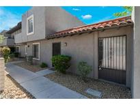 Charming home featuring a red tile roof, low maintenance yard, and neutral-toned stucco facade at 1340 N Jones Blvd, Las Vegas, NV 89108