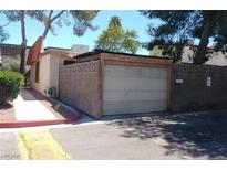 A detached one car garage featuring a block wall and concrete driveway at 3946 Voxna St, Las Vegas, NV 89119
