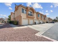 Charming two-story townhome featuring attached garages and private balconies in a well-maintained community at 5000 Red Rock St # 241, Las Vegas, NV 89118