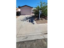 Single story home with a one car garage and desert landscaping in front yard at 510 Holick Ave, Henderson, NV 89011
