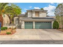 Charming two-story home with a three-car garage and well-maintained landscaping at 6 Desert Dawn Ln, Henderson, NV 89074