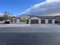 Spacious single-story home featuring a three-car garage and a well-maintained yard at 2804 Candelaria Dr, Henderson, NV 89074