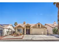 Charming single-story home with a well-maintained lawn and desert landscaping in a sunny neighborhood at 3700 Hedge Grove Dr, North Las Vegas, NV 89032
