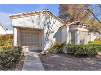 Charming single-story home featuring a red tile roof and a cozy front entry at 5401 Tassara Way # 102, Las Vegas, NV 89108