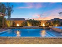 Backyard pool featuring fire bowls, and water feature at 5523 Taylor Rose Ave, Las Vegas, NV 89139
