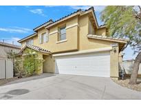 Inviting two-story home featuring a two-car garage and well-maintained landscaping at 6000 Maidenhead Dr, Las Vegas, NV 89139