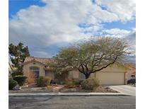 Charming single-story home featuring a well-maintained yard, two-car garage, and a classic tile roof at 6151 Naha Port Ave, Las Vegas, NV 89110